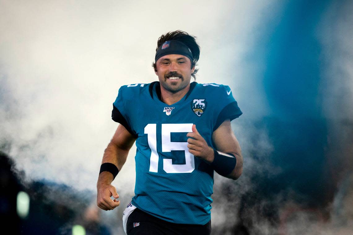 Jacksonville Jaguars quarterback Gardner Minshew (15) runs onto the field during the opening ceremonies of an NFL football game between the Jacksonville Jaguars and the Tennessee Titans, Thursday, Sept. 19, 2019, in Jacksonville, Fla. (AP Photo/Stephen B. Morton)