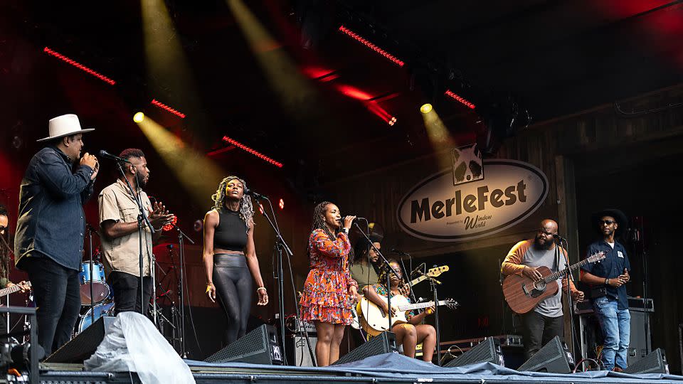 (L-R) Chris Pierce, Mel Washington, Nikki Morgan, Miko Marks, Ping Rose, Yasmin Williams, Leon Timbo and Aaron Vance of the Black Opry Revue perform during MerleFest at Wilkes Community College on April 28, 2023 in Wilkesboro, North Carolina. - Jeff Hahne/Getty Images