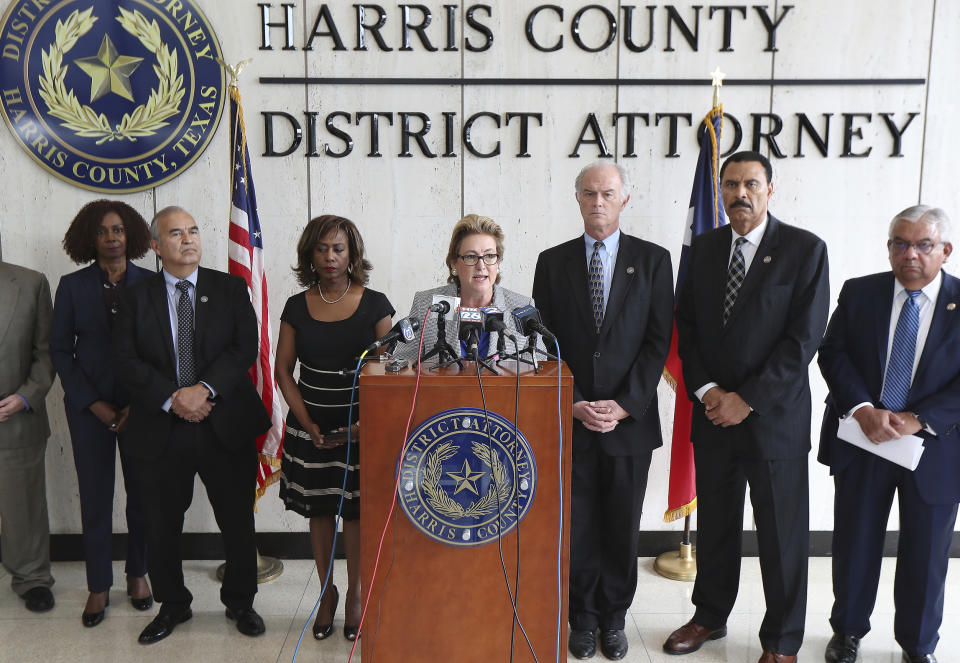 Harris County District Attorney Kim K. Ogg announces that her office has charged two officers in the Harding Street Raid Friday, Aug. 23, 2019, in Houston. A former Houston police officer has been charged with murder in connection with the deadly January drug raid of a home that killed a couple who lived there and injured five officers, prosecutors announced Friday. ( Steve Gonzales/Houston Chronicle via AP)