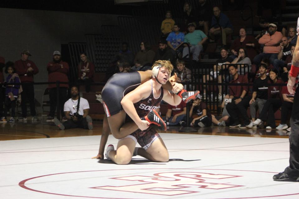 South Effingham's Ashton Anderson, the defending Class 6A 285-pound champion in action against Glynn Academy's Quay Evans on Saturday. Anderson won with a second-period fall.