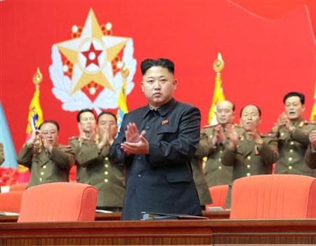 North Korean leader Kim Jong Un applauds during the second meeting of security personnel of the Korean People's Army at April 25 House of Culture