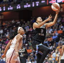 Chicago Sky center Candace Parker scores past Connecticut Sun center Brionna Jones during a WNBA semifinal playoff basketball game, Tuesday, Sept. 28, 2021, at Mohegan Sun Arena in Uncasville, Conn. (Sean D. Elliot/The Day via AP)