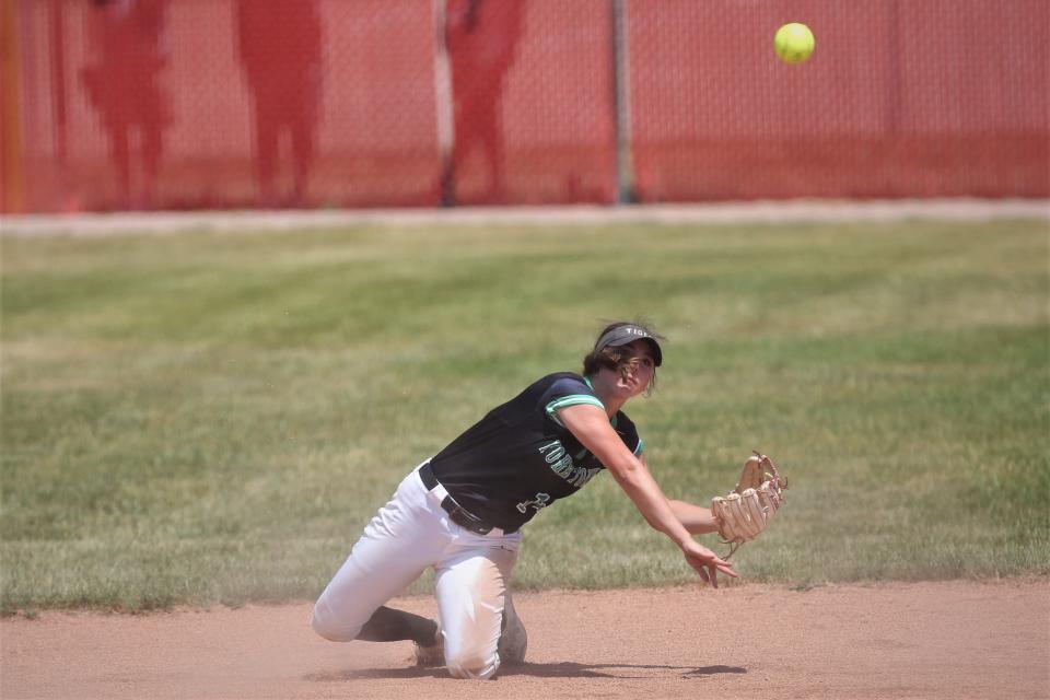 Yorktown softball's Lexy Morris makes a diving play at shortstop in the team's semistate game against Leo at Twin Lakes High School on Saturday, June 3, 2023.