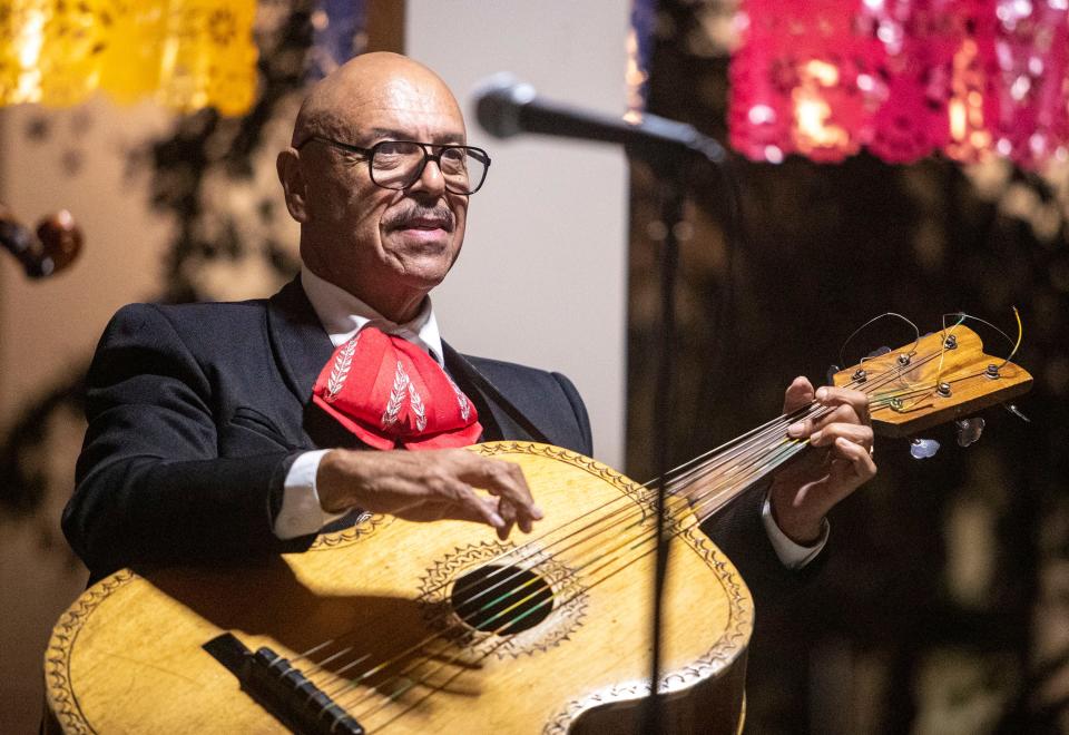 Guitarron player, singer and instructor Fernando Gonzalez performs with his band during the first Mariachi Tuesday at the Coachella Library gazebo, Tuesday, Nov. 23, 2021, in Coachella, Calif. 