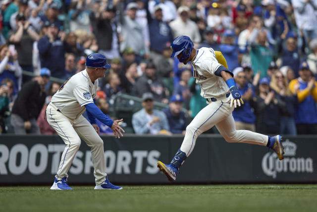 Seattle Mariners' Julio Rodriguez celebrates with first baseman Ty France after hitting a solo home run on a pitch from Houston Astros starting pitcher Brandon Bielak during the third inning of a baseball game, Sunday, May 7, 2023, in Seattle. (AP Photo/John Froschauer)