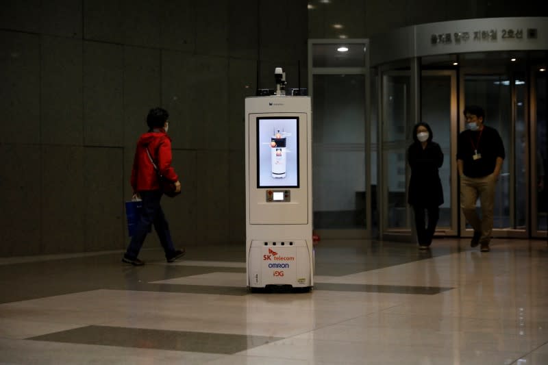 A self-driving robot travels during its demonstration at the headquarters of SK Telecom in Seoul