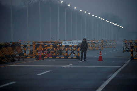 South Korean soldiers stand guard at a check point on the Grand Unification Bridge that leads to the truce village of Panmunjom, just south of the demilitarized zone separating the two Koreans, in Paju, South Korea, January 15, 2018. REUTERS/ Kim Hong-ji