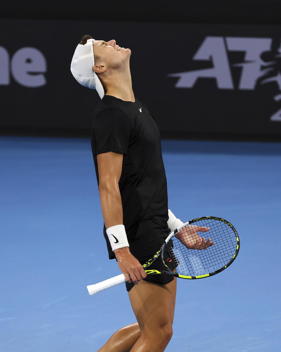Holger Rune of Denmark reacts after missing a shot in his final match against Grigor Dimitrov of Bulgaria during the Brisbane International tennis tournament in Brisbane, Australia, Sunday, Jan. 7, 2024. (AP Photo/Tertius Pickard)