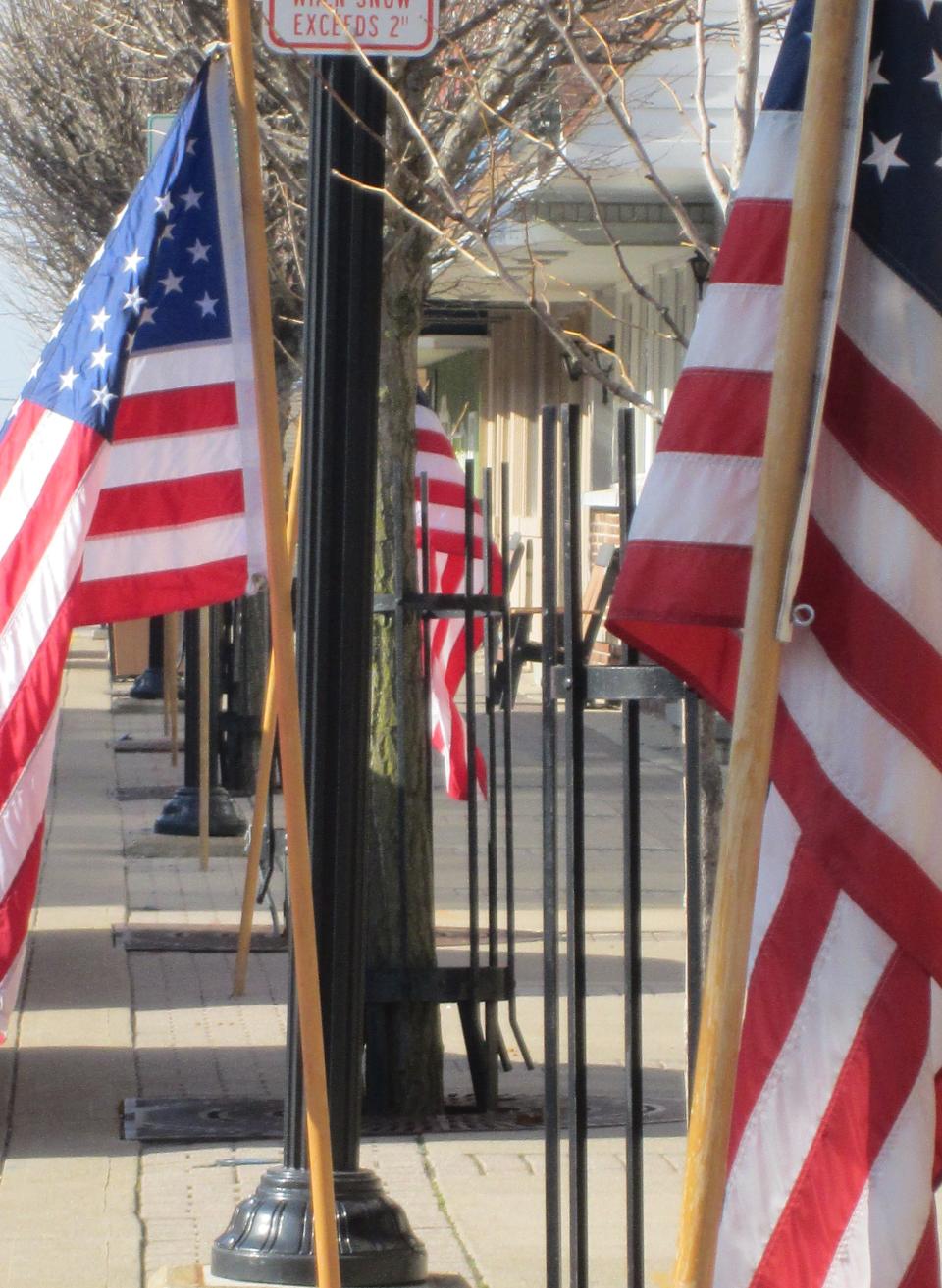Clyde Career Women members put out dozens of American flags throughout their city for each national holiday and special events.