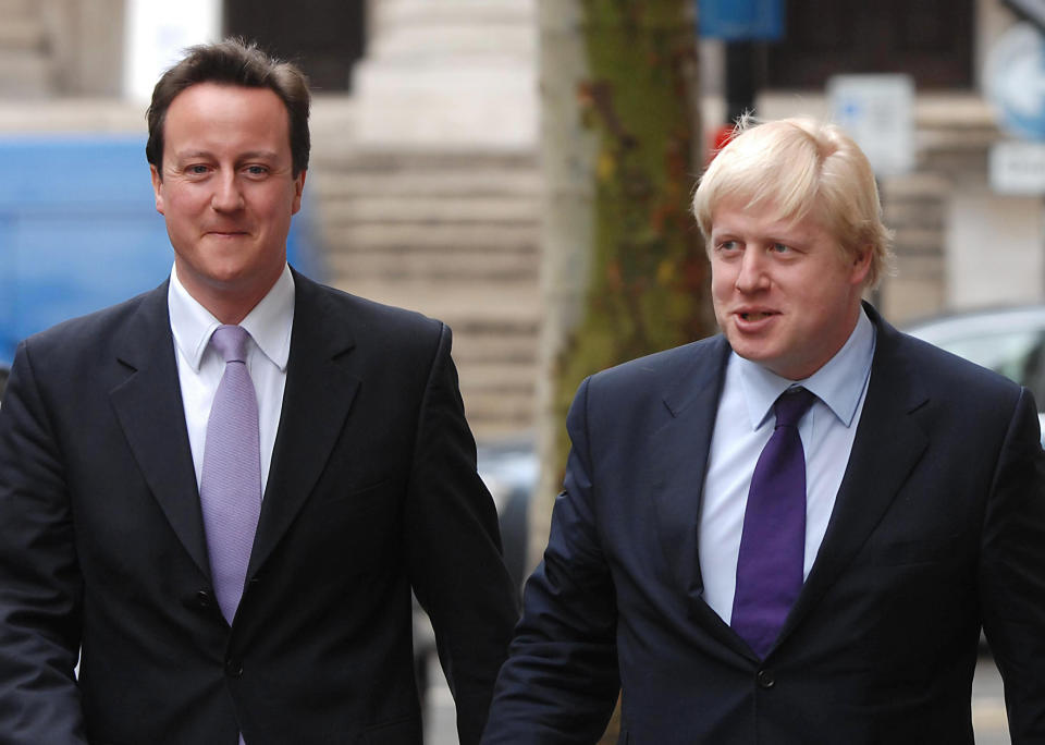 Conservative leader David Cameron (left) with Tory candidate for London Mayor Boris Johnson arrive for a press conference to launch a Conservative policy paper on Crime Mapping, in central London.