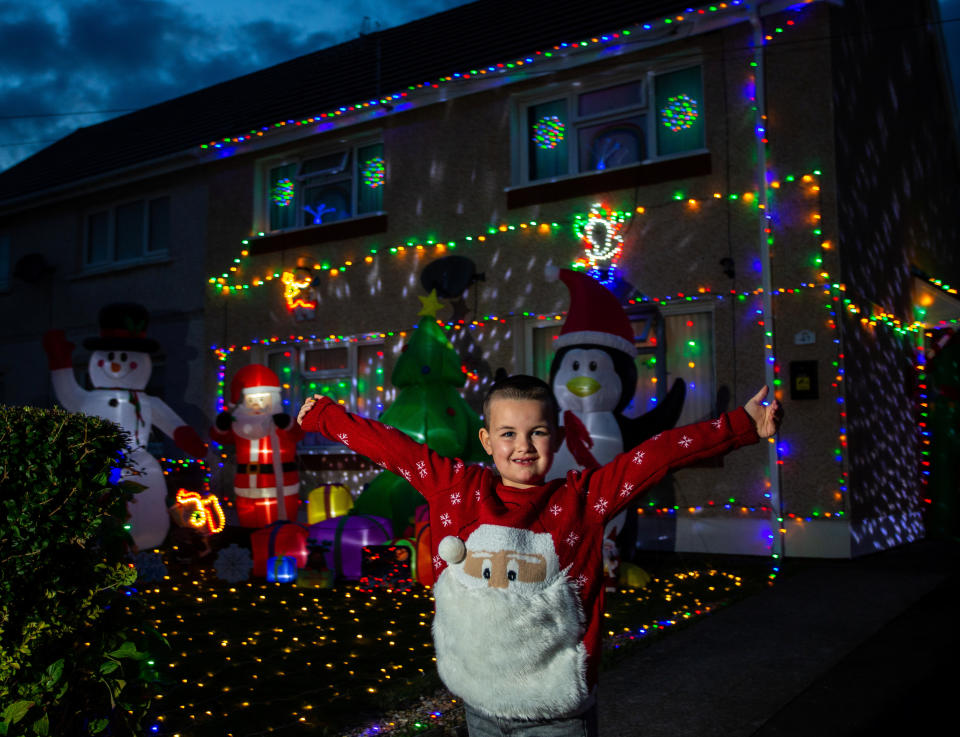 A mum has gone all out to cheer up her kids and neighbours by putting up her CHRISTMAS decorations three months early - including 3,000 outdoor lights. Caroline Gabe, 46, has been shielding with her children since March - and said putting up her tree and decorations in September was a much-needed boost. She has spent the year buying outdoor lights and installations - from as far away as America - and put them all up last week, on a whim. Almost all of them are outside - including 3,000 fairy lights, sparkling snow, an 8ft inflatable snowman, as well as Santa and his reindeer.