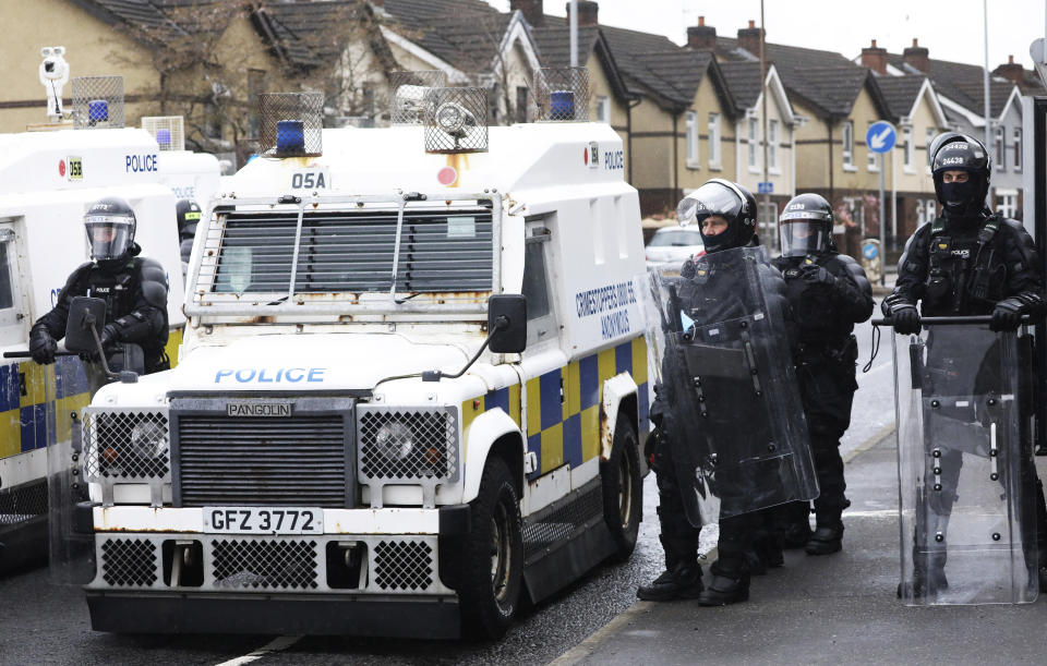 Police block a road near the Peace Wall in West Belfast, Northern Ireland, Thursday, April 8, 2021. Authorities in Northern Ireland sought to restore calm Thursday after Protestant and Catholic youths in Belfast hurled bricks, fireworks and gasoline bombs at police and each other. It was the worst mayhem in a week of street violence in the region, where Britain's exit from the European Union has unsettled an uneasy political balance. (AP Photo/Peter Morrison)