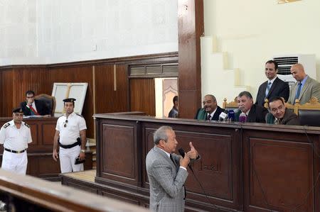 Naguib Sawiris, one of Egypt's wealthiest businessmen, testifies during the retrial of Al-Jazeera television journalists at a court in Cairo, April 22, 2015. REUTERS/Shadi Bushra