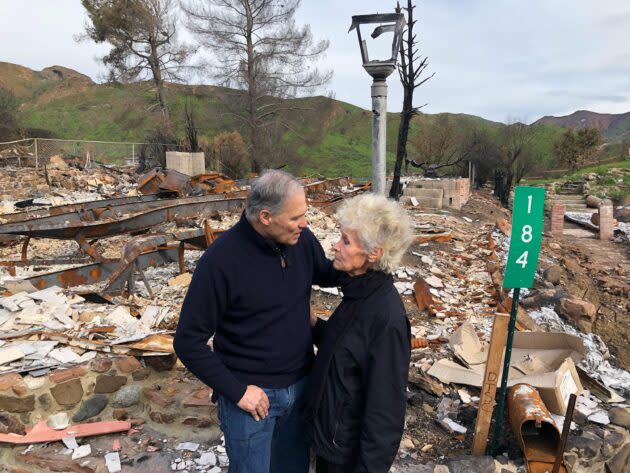 Washington Gov. Jay Inslee talks with Marsha Maus, a resident of Agoura Hills, Calif., during a visit to the site of the Woolsey Fire, which Inslee said “was made worse by climate change.” (Jay Inslee Photo via Twitter)