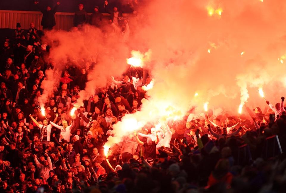 Legia Warsaw fans in the stands set off flares during the match at the King Power Stadium (Mike Egerton/PA) (PA Wire)