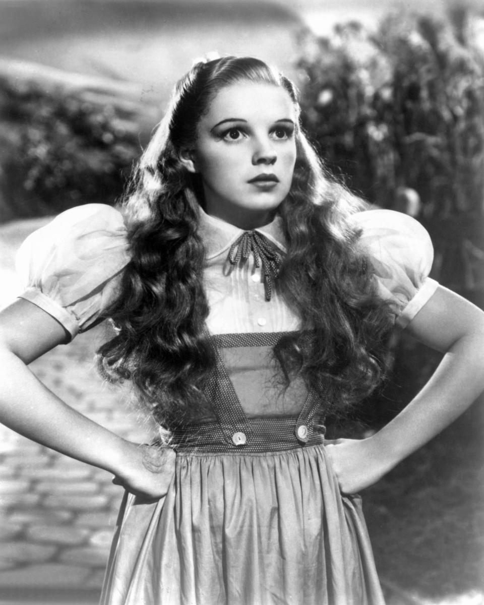 Judy Garland as Dorothy Gale, wearing a gingham dress with puffed sleeves, in a scene from 