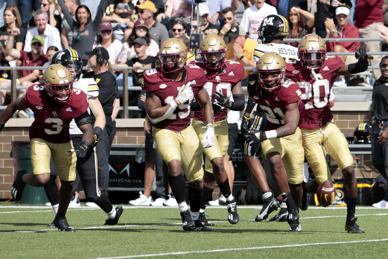 Boston College's Josh DeBerry (21) and teammates celebrate his interception during a game against Missouri on Saturday. (Fred Kfoury III/Icon Sportswire via Getty Images)