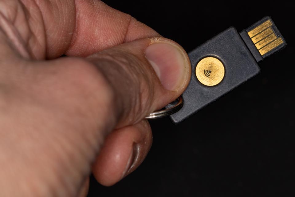 An encrypted USB security key is a physical device, costing around $25, that you plug into your computer or tap against an enable device. It can't be fooled by scammers and can protect multiple accounts.