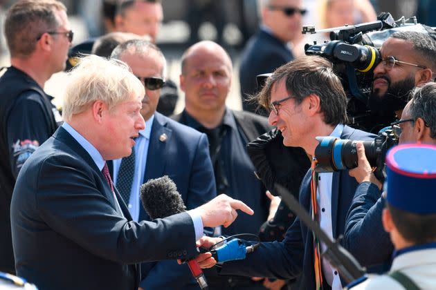 Peston speaking to Prime Minister Boris Johnson (Photo: BERTRAND GUAY via Getty Images)