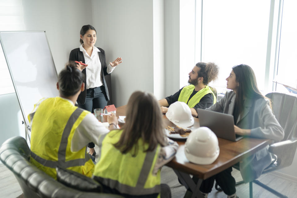 a group of people sitting around a table