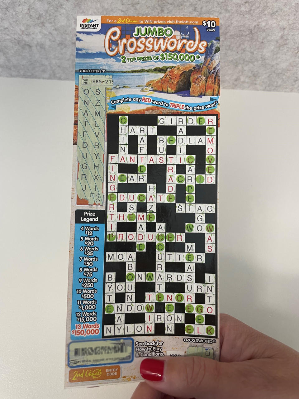 The woman's winning Mother's Day Jumbo Crossword scratch card.