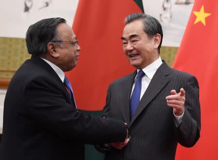 Bangladesh's Foreign Minister Abul Hassan Mahmood Ali (L) shakes hands with China's Foreign Minister Wang Yi before a meeting at the Diaoyutai State Guesthouse in Beijing, China June 29, 2018. Greg Baker/Pool via REUTERS