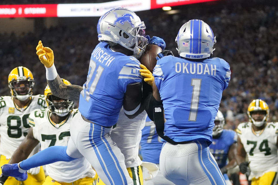 Detroit Lions safety Kerby Joseph (31) intercepts a pass intended for Green Bay Packers wide receiver Christian Watson during the first half of an NFL football game, Sunday, Nov. 6, 2022, in Detroit. (AP Photo/Paul Sancya)