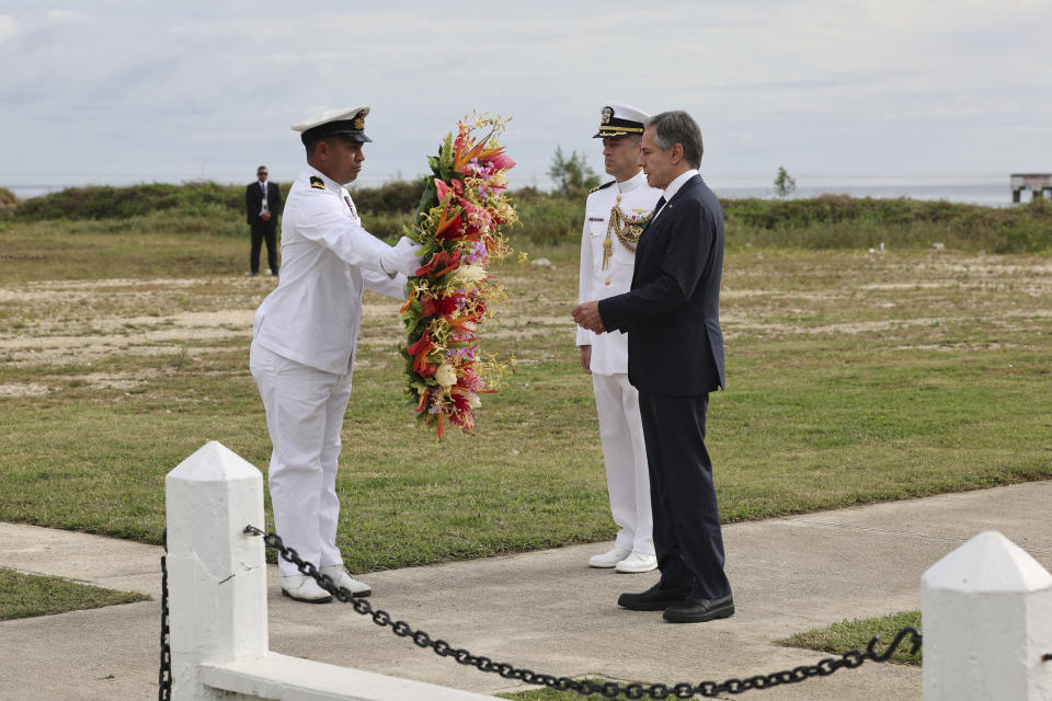 U.S. Secretary of State Antony Blinken, right, attends a wreath-laying ceremony at Tonga's War Memorial in Nuku'alofa, Tonga Wednesday, July 26, 2023. (Tupou Vaipulu/Pool Photo via AP)