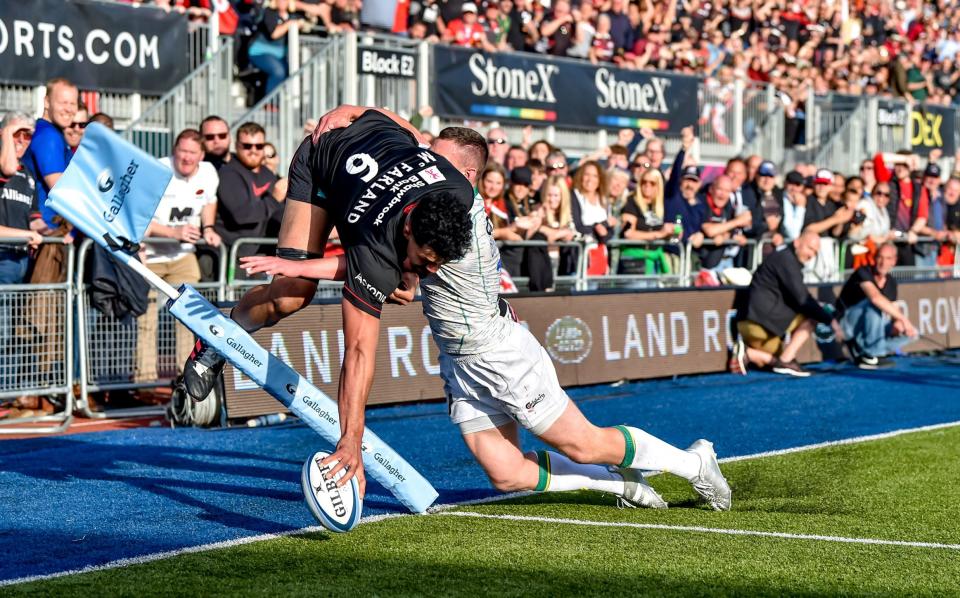 Theo McFarland goes airborn to touch down for Saracens - PHIL HUTCHINSON