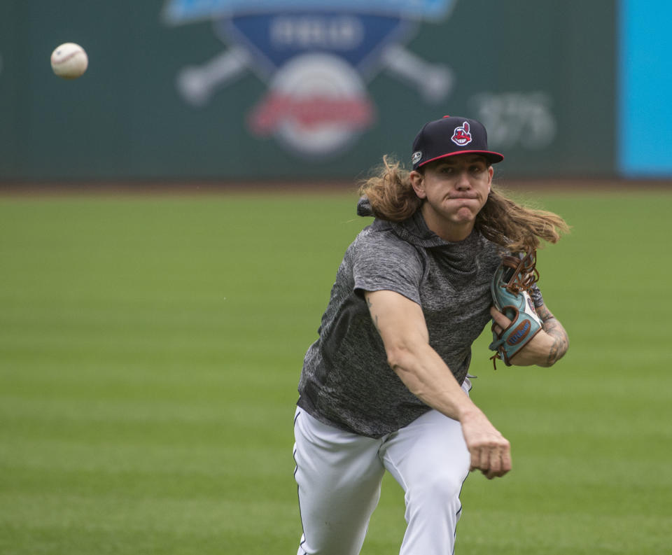 Cleveland Indians starting pitcher Mike Clevinger throws during a workout in Cleveland, Sunday, Oct. 7, 2018. The Indians play the Houston Astros in the third game of their ALDS series Monday. (AP Photo/Phil Long)