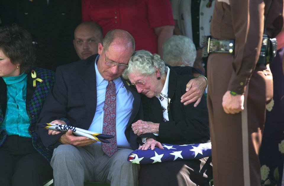Lewis Catron hugged his mother, Jennie Rachel Catron, on April 18, 2002 at the funeral for his brother and her son, Sam Catron, who was assassinated by a man working with a drug dealer.
