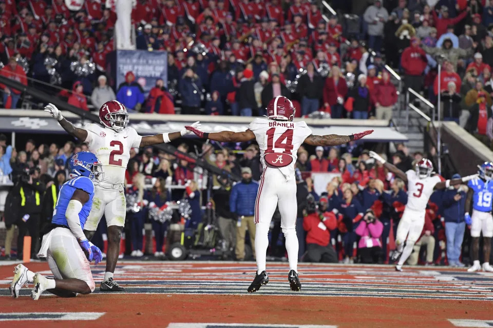 Alabama defensive backs DeMarcco Hellams (2) and Brian Branch (14) celebrate after an incomplete fourth-down pass intended for Mississippi wide receiver Jonathan Mingo (1) during the second half of an NCAA college football game in Oxford, Miss., Saturday, Nov. 12, 2022. Alabama won 30-24. (AP Photo/Thomas Graning)