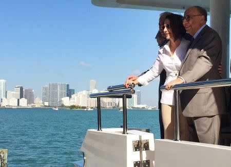 Performer Gloria Estefan arrives at the Miami Marine Stadium with the stadium's original architect Hilario Candela (R) in Miami November 13, 2014. REUTERS/Zachary Fagenson