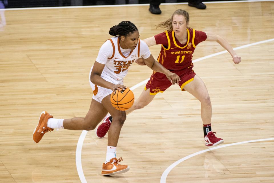 Mar 12, 2024; Kansas City, MO, USA; Texas Longhorns forward Madison Booker (35) handles the ball while defended by Iowa State Cyclones guard Emily Ryan (11) during the first half at T-Mobile Center.