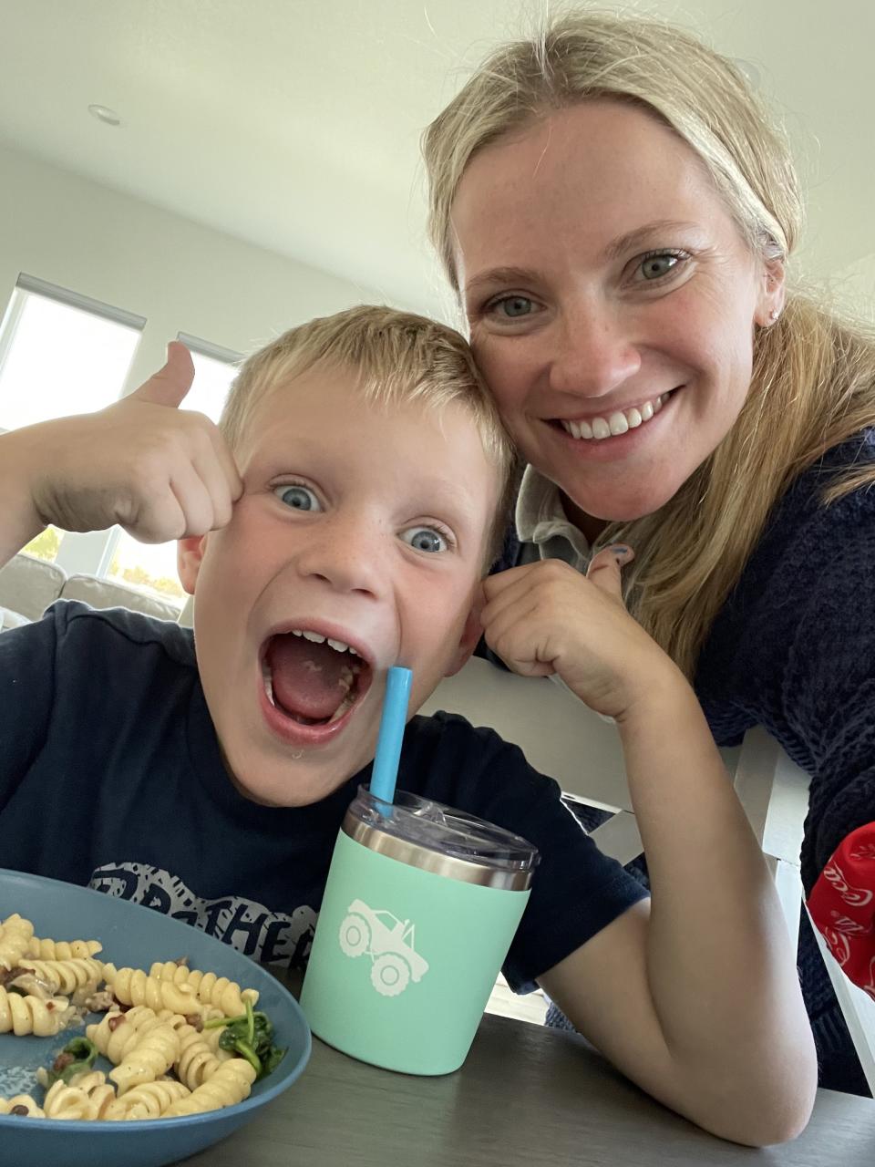 The author smiling with her son