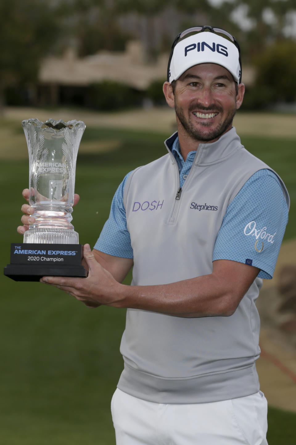 Andrew Landry holds his trophy after winning The American Express golf tournament on the Stadium Course at PGA West in La Quinta, Calif., Sunday, Jan. 19, 2020. (AP Photo/Alex Gallardo)
