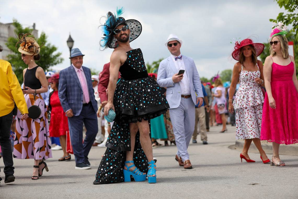 Saul Sugarman wears a dress he designed for the Kentucky Derby 150.