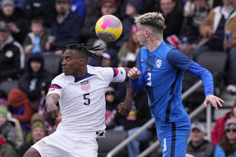 United States defender DeJuan Jones (5) and Slovenia defender Srdan Kuzmic (3) battle for a head ball during the first half of an international friendly soccer match in San Antonio, Saturday, Jan. 20, 2024. (AP Photo/Eric Gay)