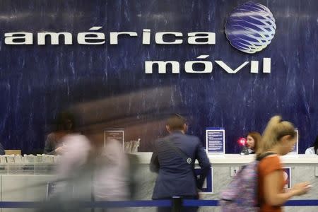 The logo of America Movil is pictured on the wall of a reception area in the company's corporate offices in Mexico City, Mexico, May 18, 2017. REUTERS/Edgard Garrido