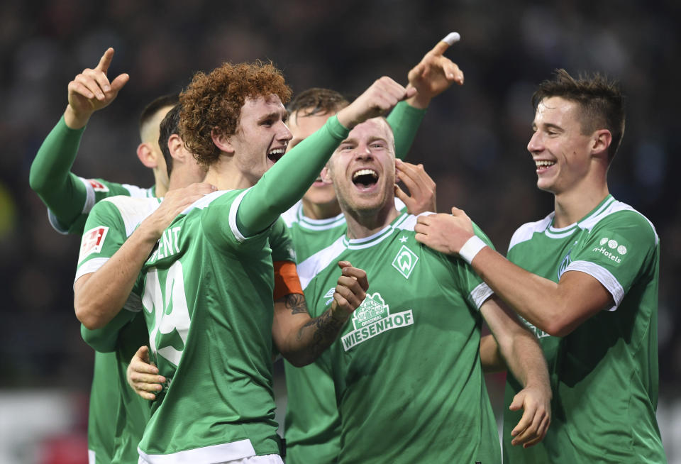 FILE - In this Dec 7, 2018 file photo Werder Bremen's Josh Sargent, left, celebrates with teammates after scoring a goal against Fortuna Duesseldorf during a Bundesliga soccer match in Bremen, Germany. (Carmen Jaspersen/dpa via AP, file)