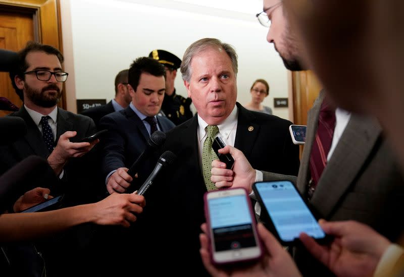 FILE PHOTO: U.S. Senator Doug Jones arrives for briefing on corona virus on Capitol Hill in Washington