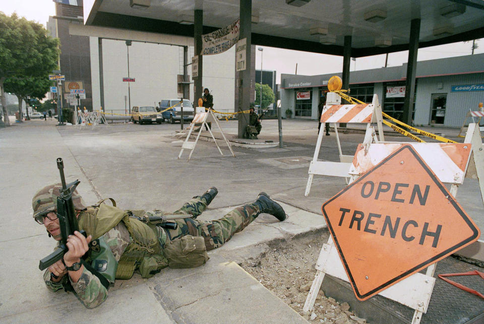 National Guardsman takes position at gas station