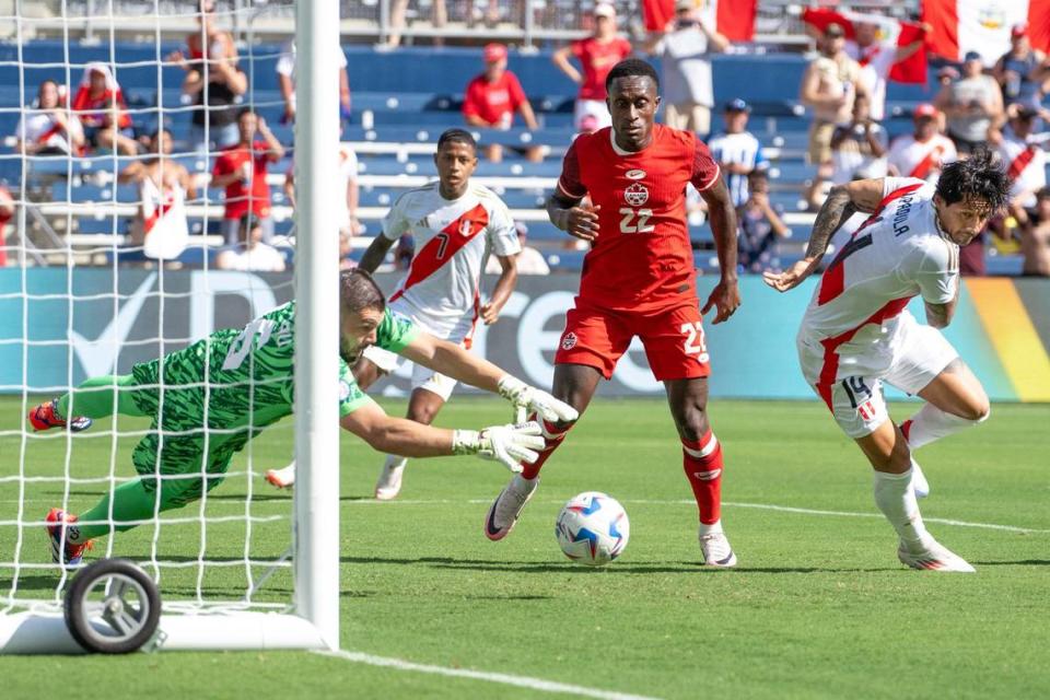 Canada goalkeeper Maxime Crépeau (16) blocks a shot by Peru forward Gianluca Lapadula (14) during a Group A Copa America 2024 match Tuesday at Children’s Mercy Park.
