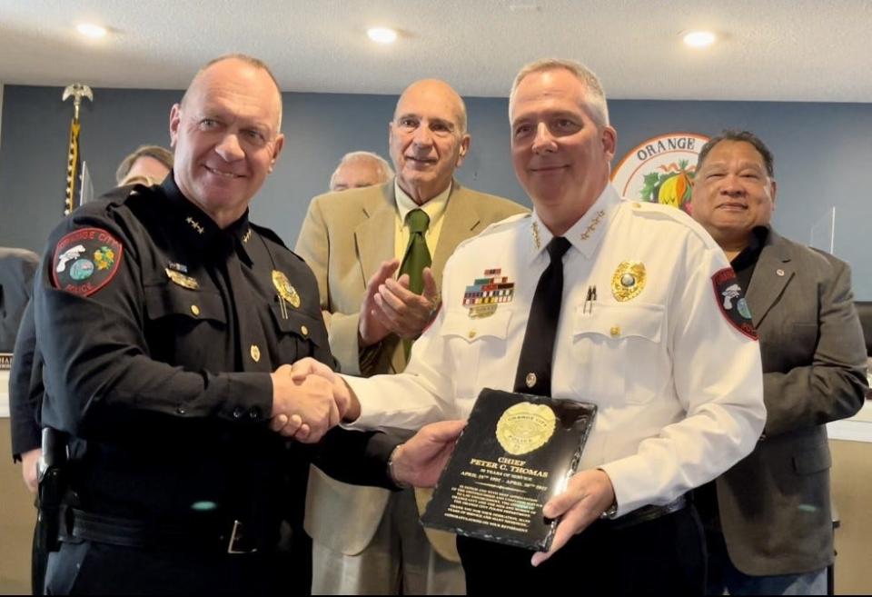 Orange City Police Deputy Chief Wayne Miller, left, with retiring Chief Peter Thomas. Miller will be sworn in as the new chief on Friday.