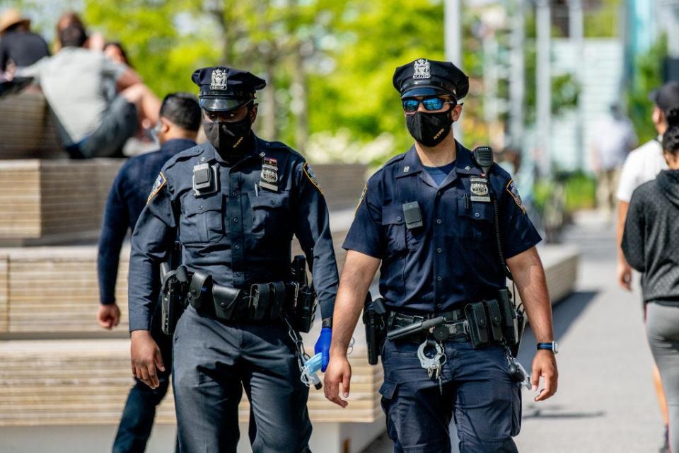 New York City police officers wearing protective face masks on patrol in Williamsburg, Brooklyn, on May 17, 2020.