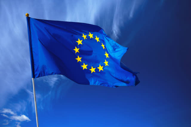 Flag of the european union in front of the deep blue sky.