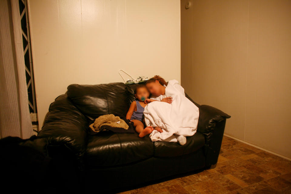 A grandmother living in a railroad apartment with her daughter, son-in-law, and seven grandchildren. (Photo by Andrew Lichtenstein/Corbis via Getty Images)