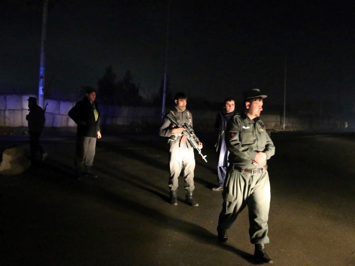 Security forces block the roads at the site of a suicide bomb attack in Kabul, Afghanistan: AP