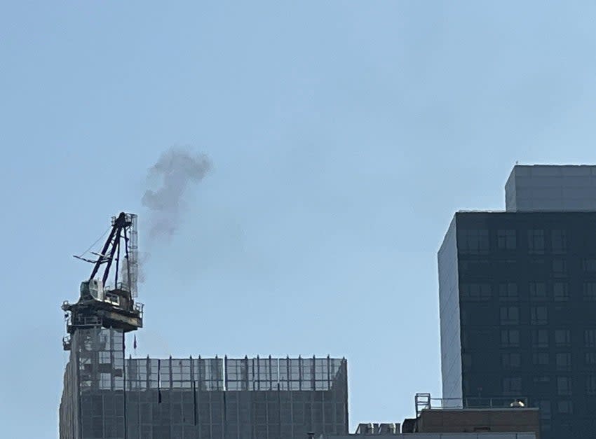 Smoke billows into the air from the crane (NYC Mayor’s Office)