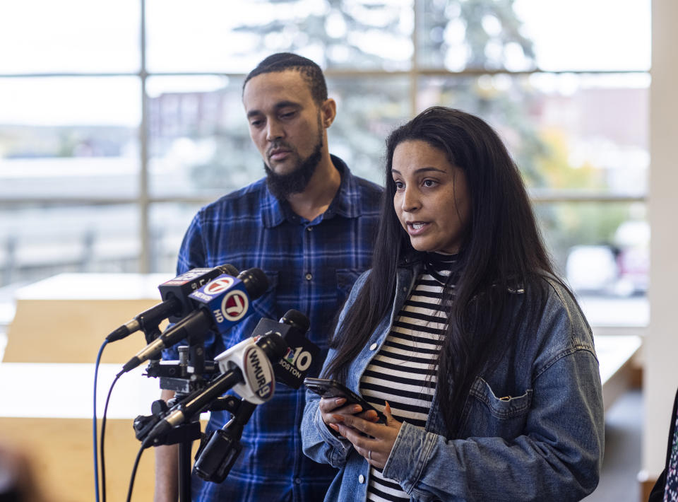 Brian Reid, left, listens as his wife Jackie speaks at Merrimack County Superior Court in Concord, N.H. Monday, October 23, 2023. After deliberating for a day and a half, a jury found Logan Clegg guilty of second-degree murder in the April 2022 killings of Stephen and Djeswende Reid. (Geoff Forester/The Concord Monitor via AP, Pool)